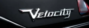 3D chrome custom car emblem mounted on a black trunk lid